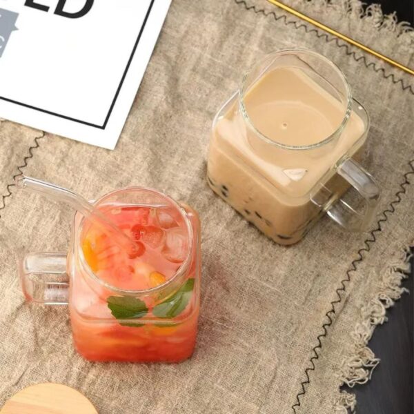 Glass cup with straw