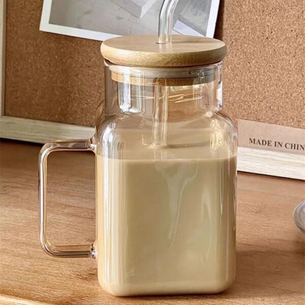 Glass cup with straw
