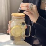 Glass cup with straw