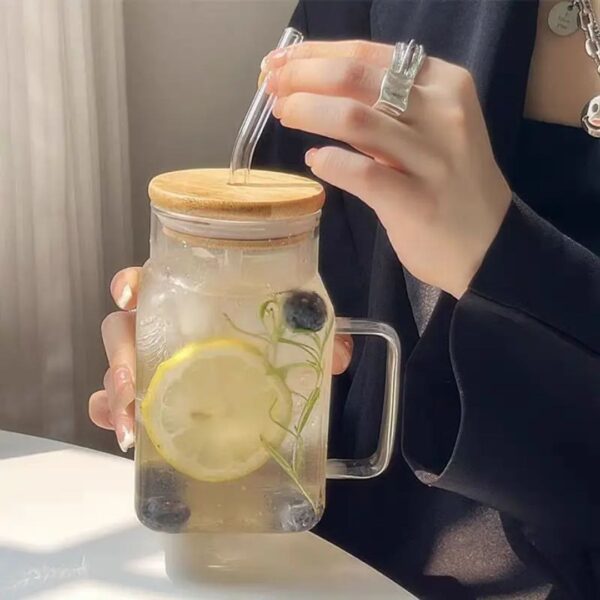 Glass cup with straw