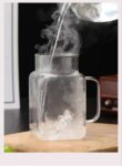 Glass cup with straw