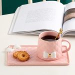 Elegant Pink Ceramic Mug and Saucer Set with Bow